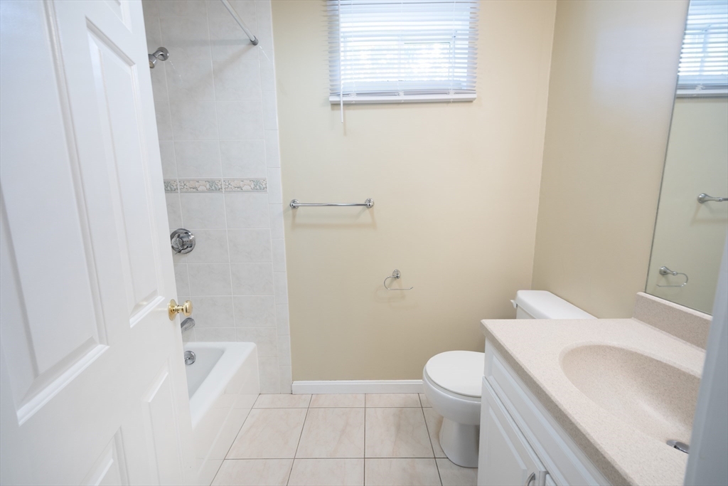 54 Spruce Street Winchester, MA 01890 - Photo 26 of 29 a bathroom with a sink a toilet and shower