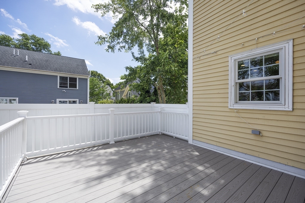 54 Spruce Street Winchester, MA 01890 - Photo 28 of 29 a view of a house with a roof deck