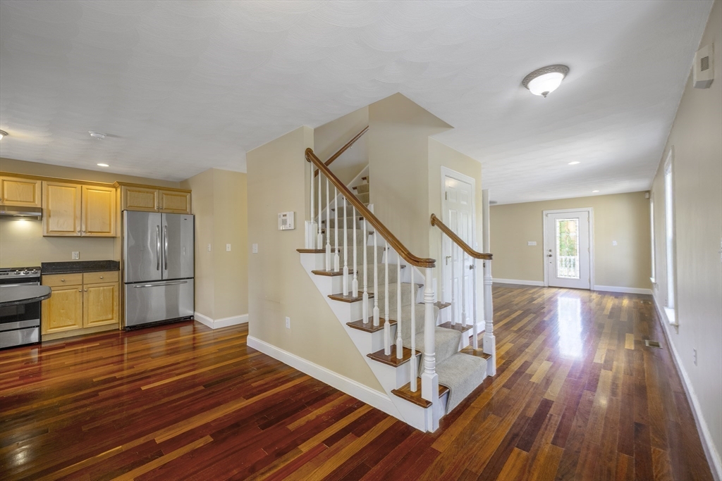 54 Spruce Street Winchester, MA 01890 - Photo 7 of 29 a view of entryway and hall with wooden floor
