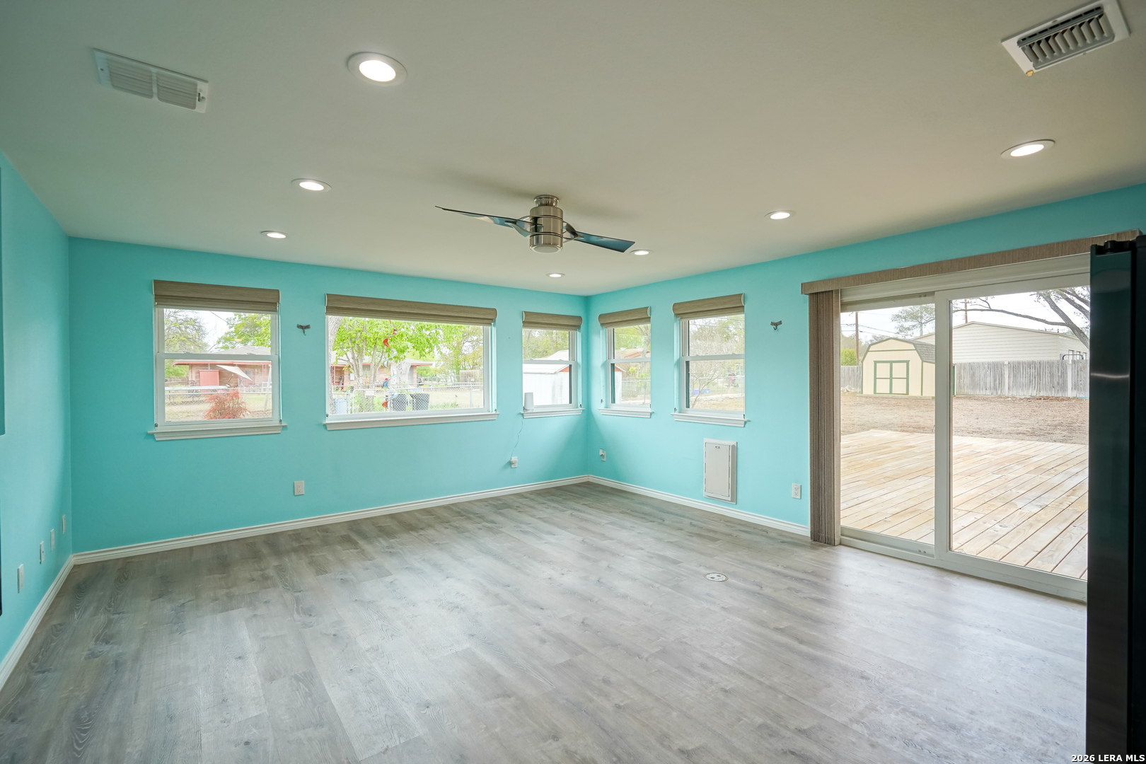 245 Windcrest Drive Windcrest, TX 78239 - Photo 15 of 50 a view of an empty room with a window and wooden floor