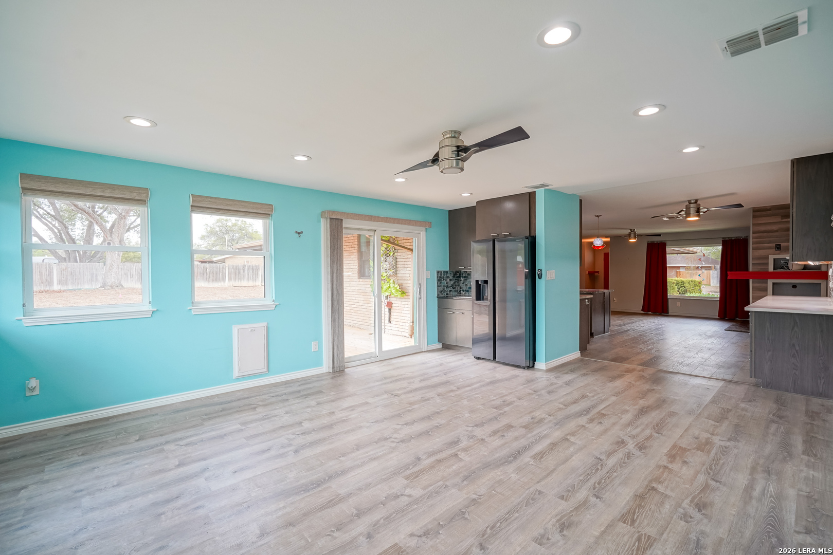 245 Windcrest Drive Windcrest, TX 78239 - Photo 16 of 50 a view of an empty room with window and wooden floor
