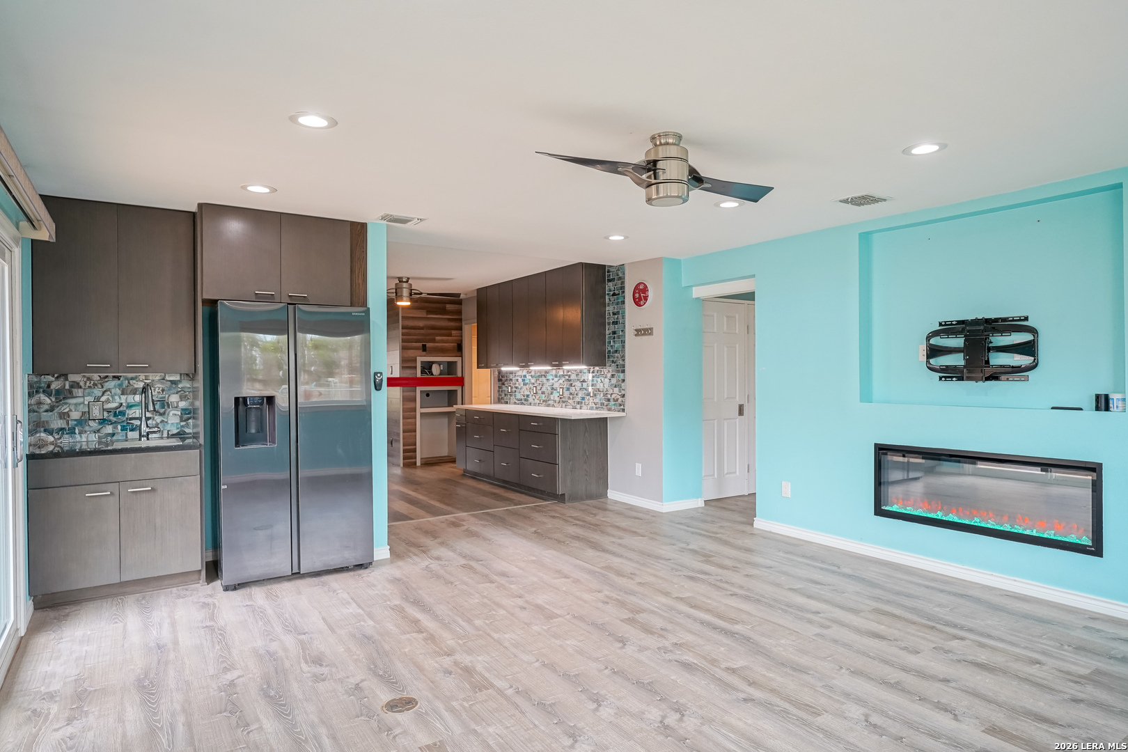 245 Windcrest Drive Windcrest, TX 78239 - Photo 17 of 50 a view of a kitchen with a refrigerator and a microwave