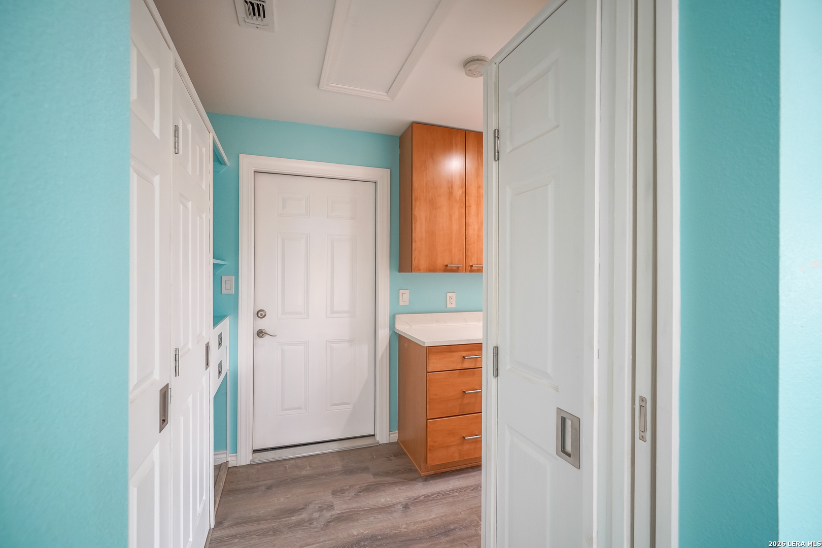 245 Windcrest Drive Windcrest, TX 78239 - Photo 18 of 50 a view of a hallway with wooden floor