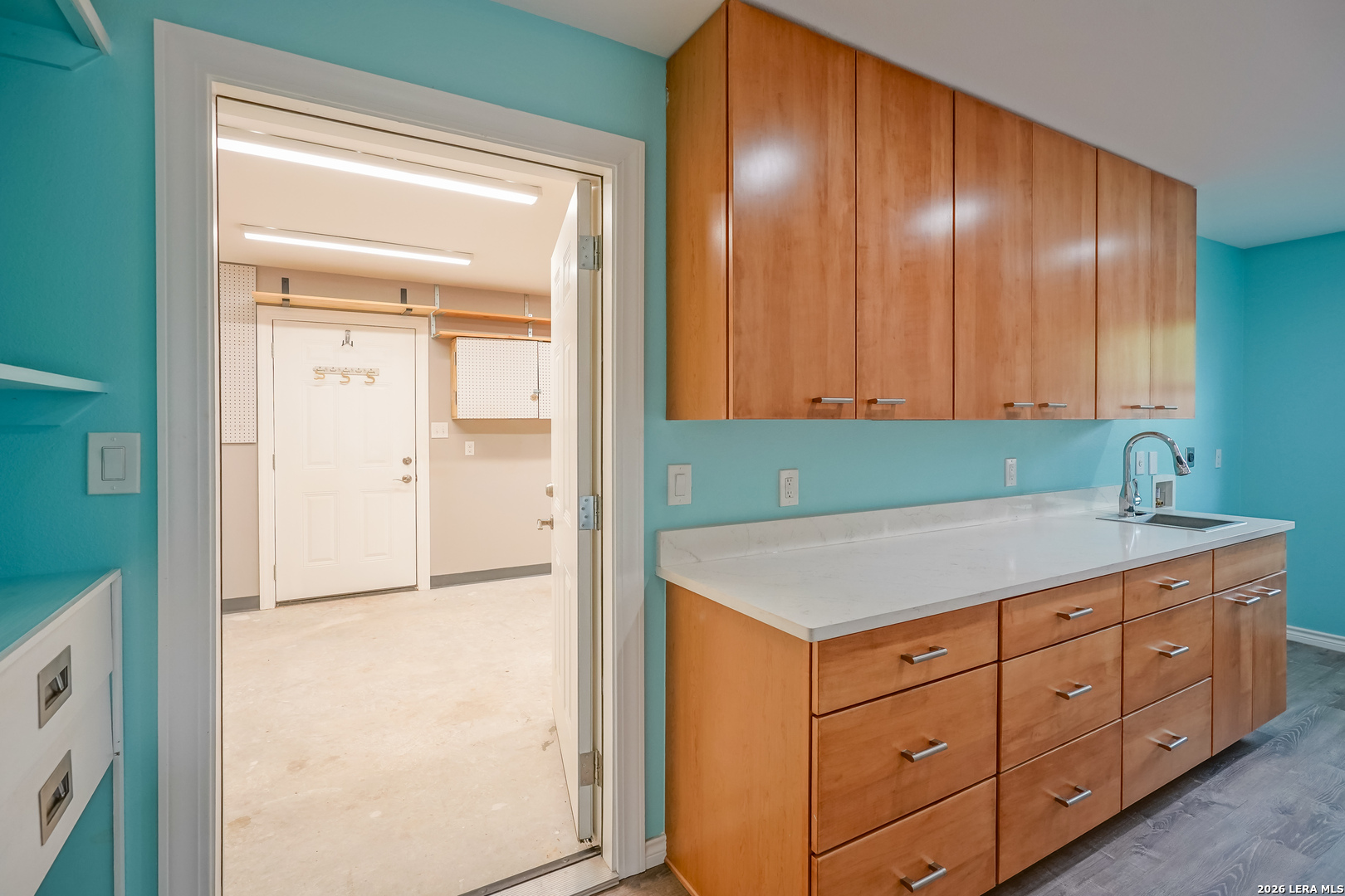 245 Windcrest Drive Windcrest, TX 78239 - Photo 23 of 50 a kitchen with a refrigerator and cabinets