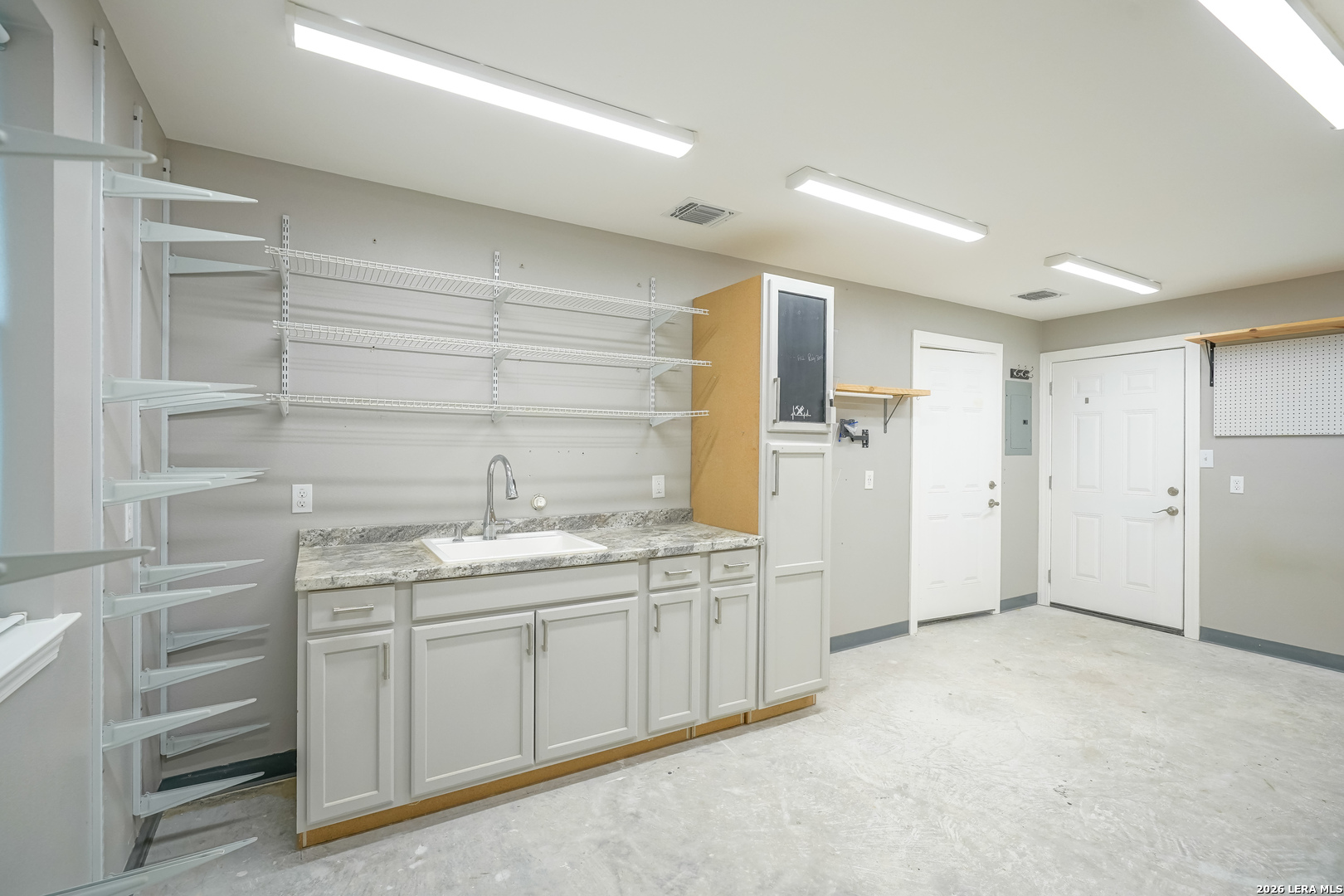 245 Windcrest Drive Windcrest, TX 78239 - Photo 25 of 50 a bathroom with a granite countertop sink two mirror and a shower