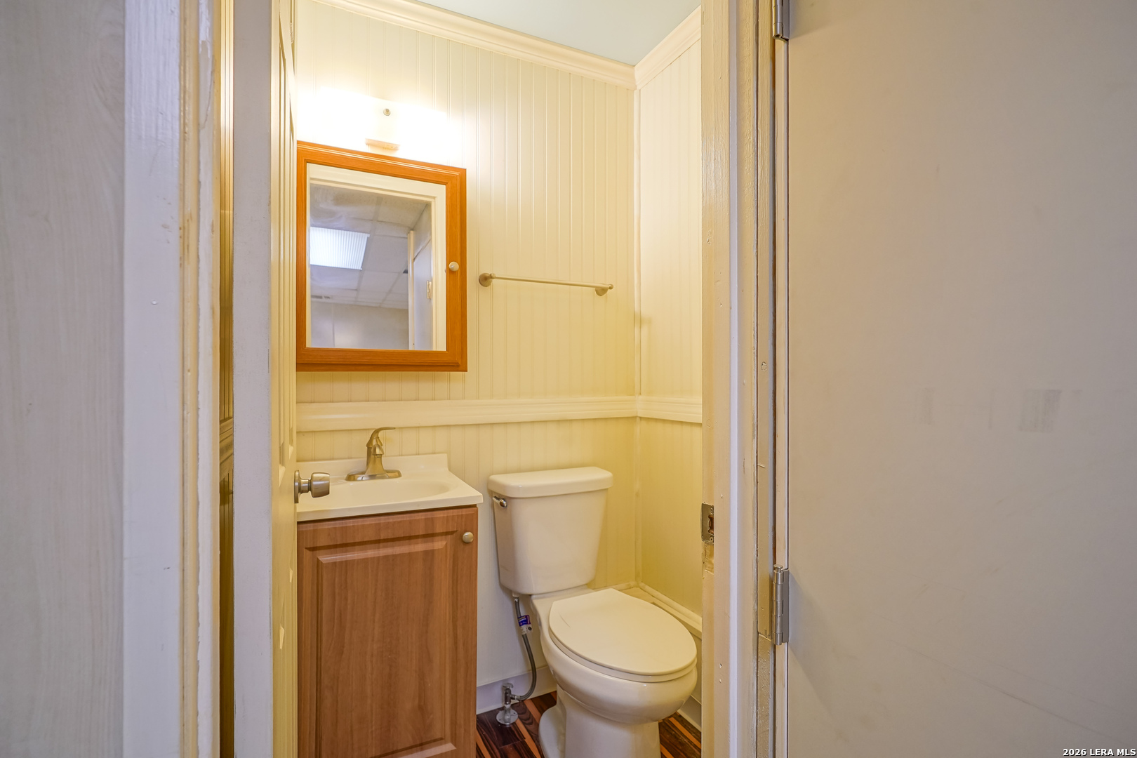 245 Windcrest Drive Windcrest, TX 78239 - Photo 29 of 50 a white toilet sitting next to a bathroom sink