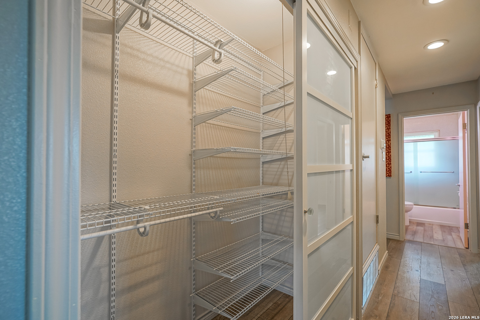 245 Windcrest Drive Windcrest, TX 78239 - Photo 35 of 50 a bathroom with a glass shower door