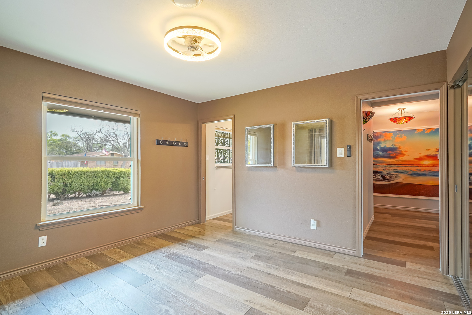 245 Windcrest Drive Windcrest, TX 78239 - Photo 37 of 50 a view of an empty room with wooden floor and a window
