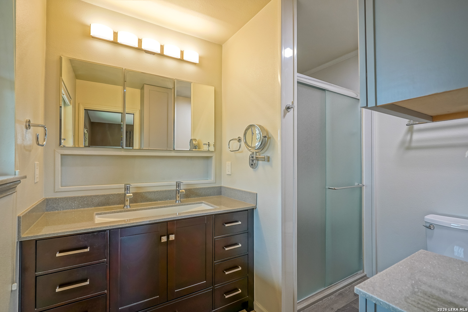 245 Windcrest Drive Windcrest, TX 78239 - Photo 39 of 50 a bathroom with a sink and a mirror