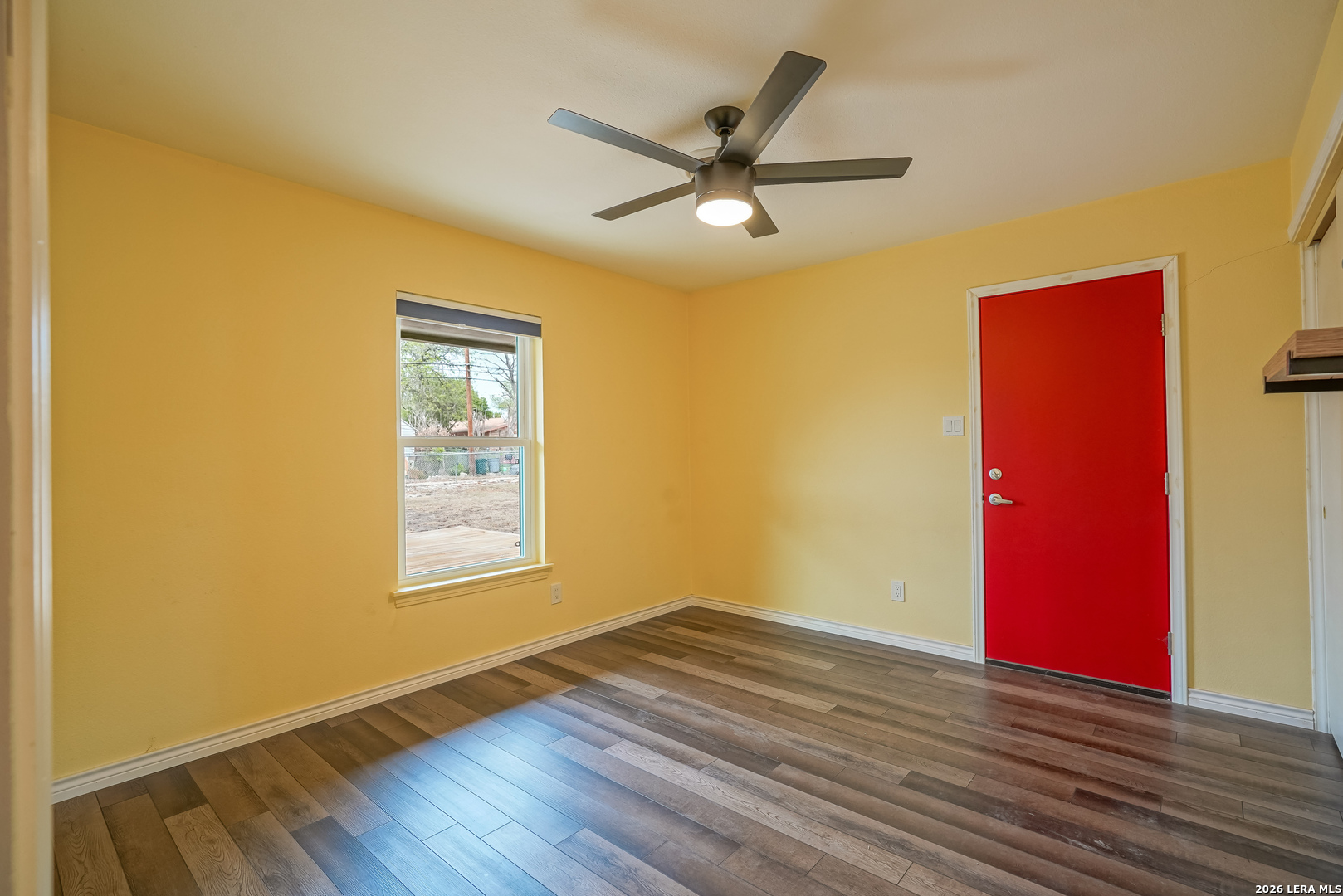 245 Windcrest Drive Windcrest, TX 78239 - Photo 40 of 50 a view of an empty room with wooden floor and a window
