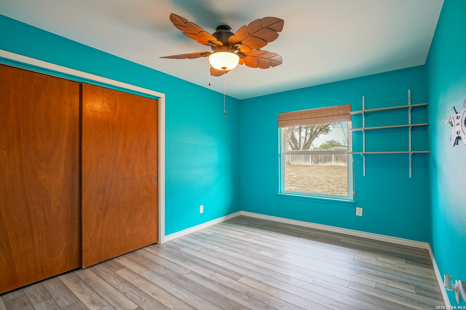 245 Windcrest Drive Windcrest, TX 78239 - Photo 42 of 50 wooden floor in an empty room with a window