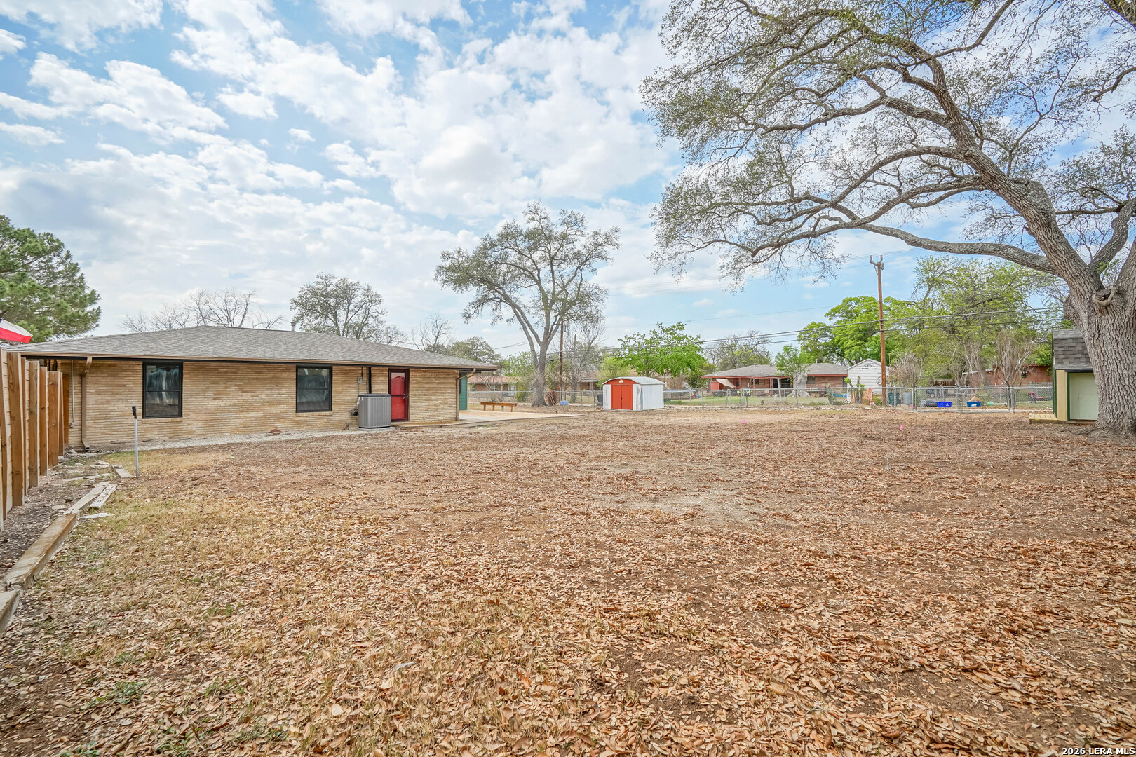 245 Windcrest Drive Windcrest, TX 78239 - Photo 47 of 50 a front view of a house with a yard and garage
