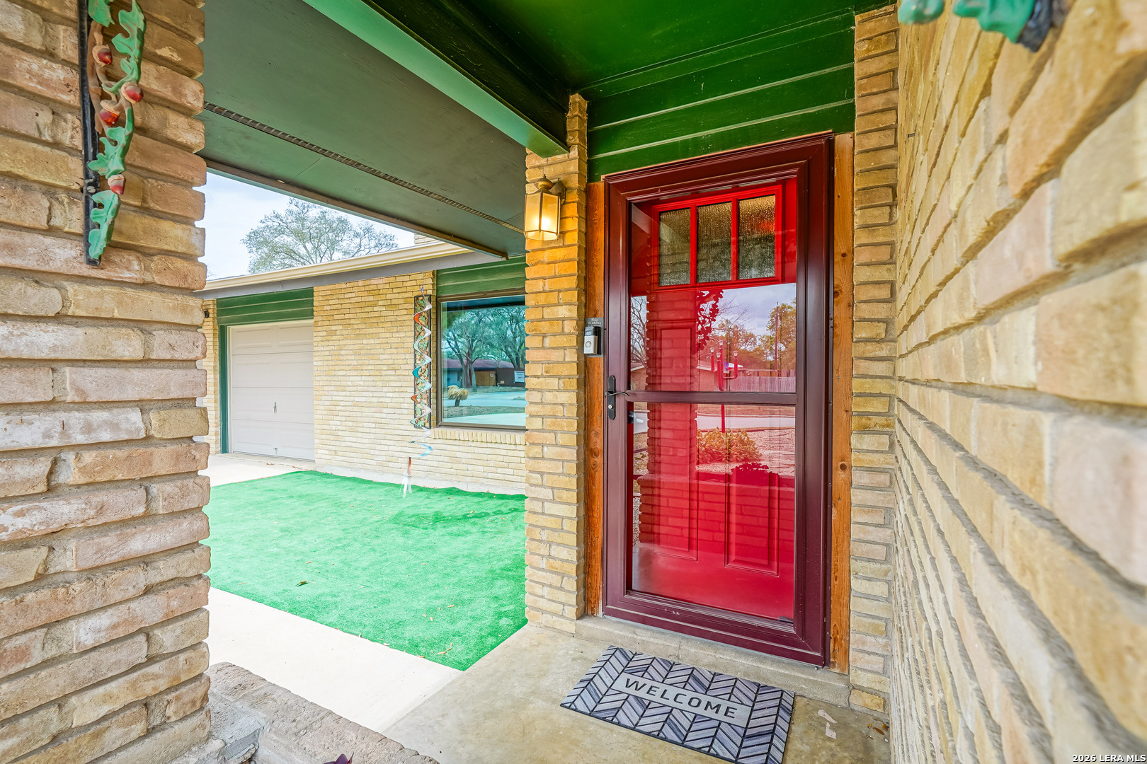 245 Windcrest Drive Windcrest, TX 78239 - Photo 6 of 50 a view of a red door of the house