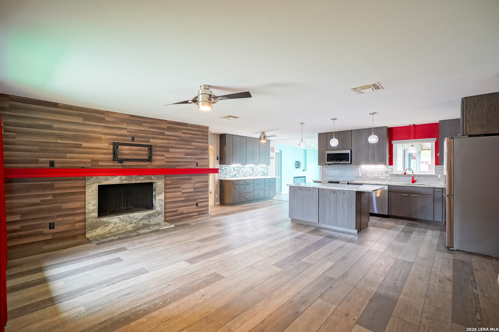 245 Windcrest Drive Windcrest, TX 78239 - Photo 10 of 50 a kitchen with stainless steel appliances kitchen island wooden cabinets and granite counter tops