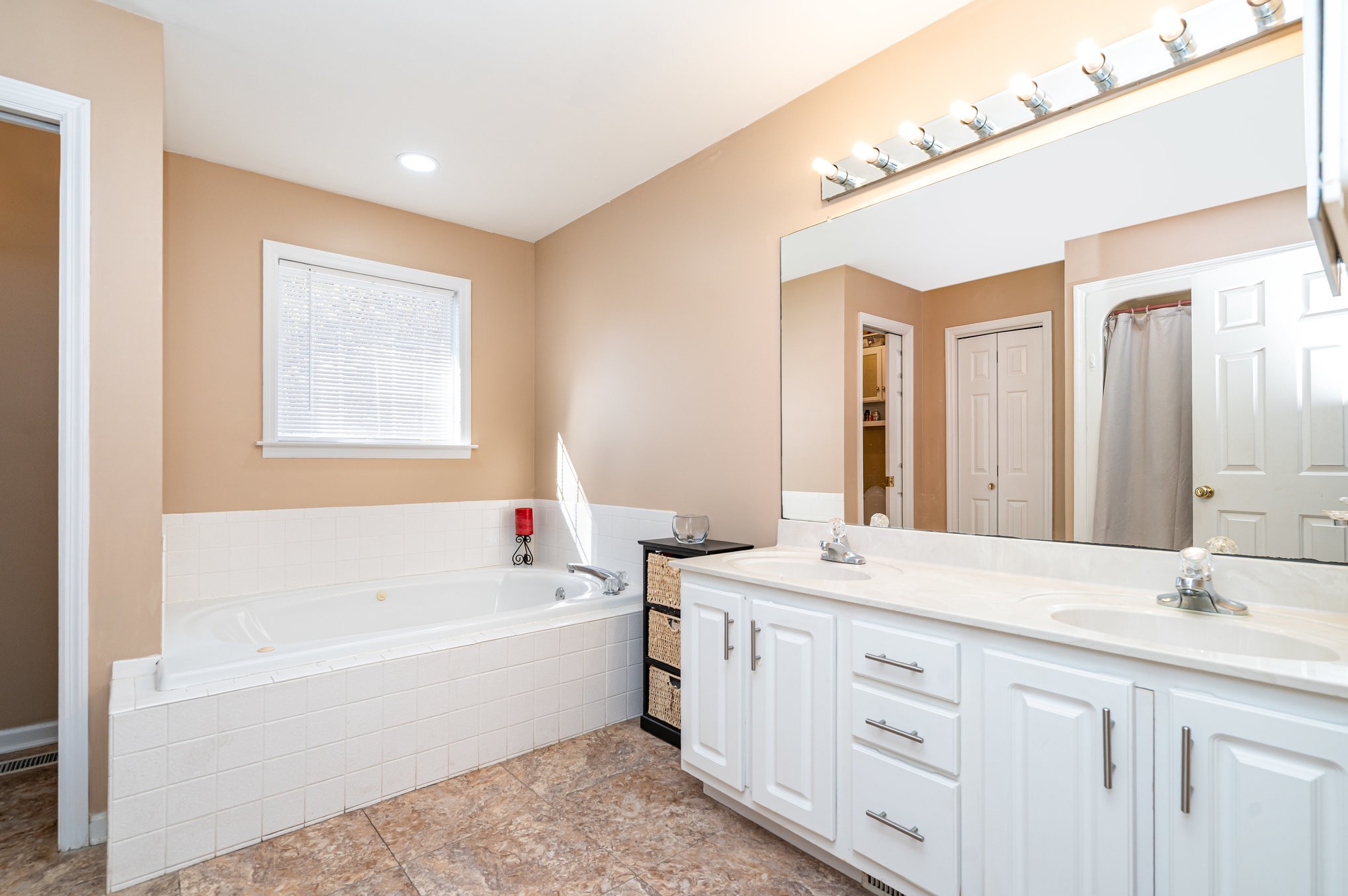 5221 Grand View Lane Pleasant View, TN 37146 - Photo 17 of 39 a bathroom with a tub a sink and mirror