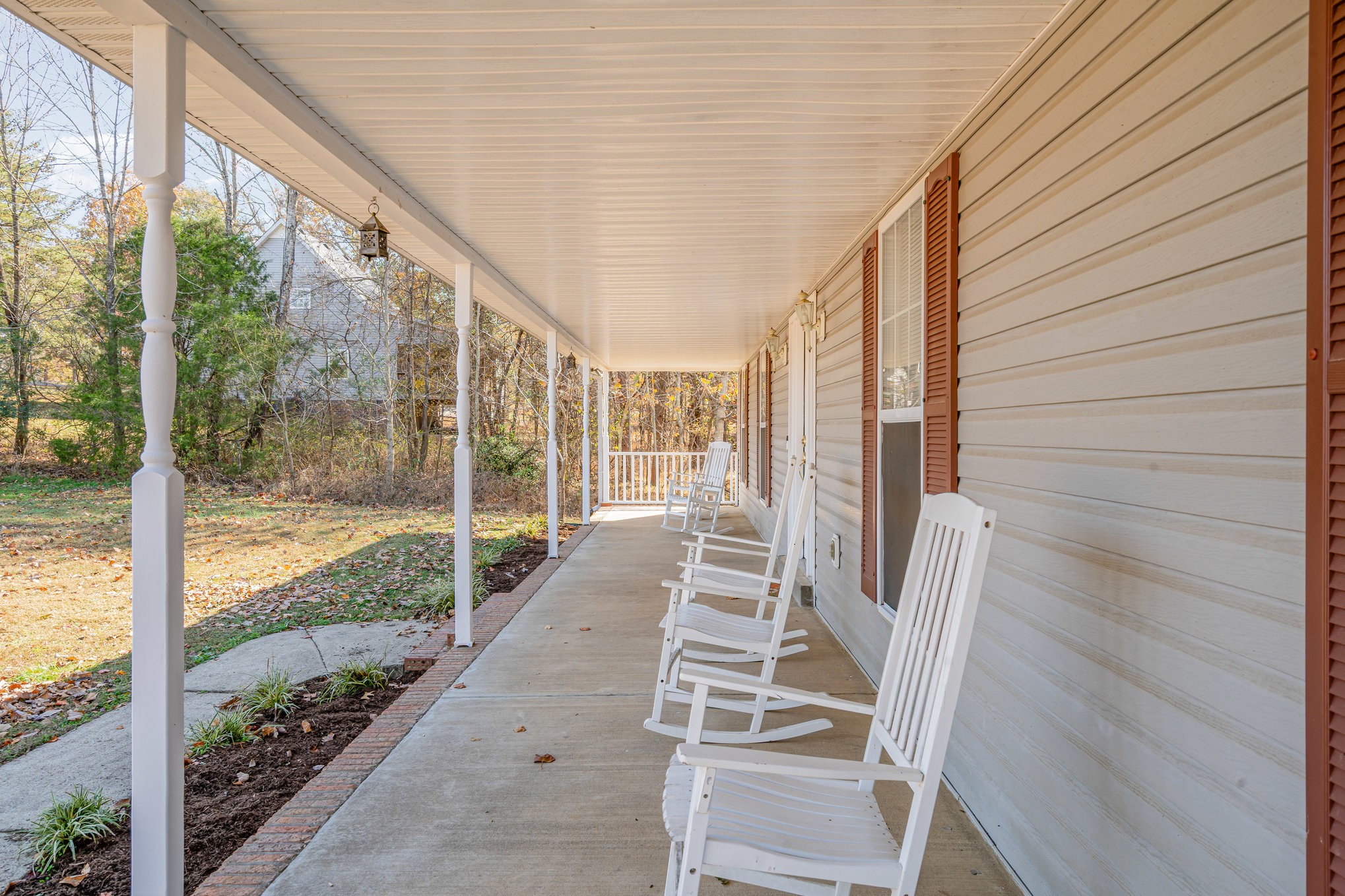 5221 Grand View Lane Pleasant View, TN 37146 - Photo 4 of 39 a view of a porch with wooden floor and stairs