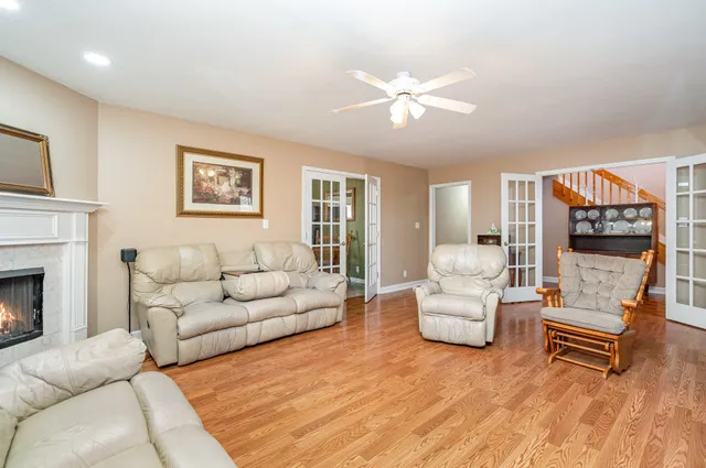a living room with furniture and a fireplace