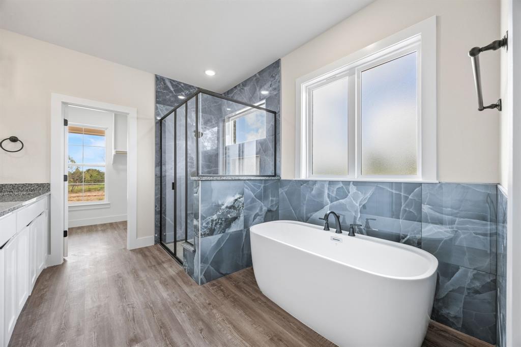 Lot 5 Slate Rock Road Ennis, TX 75119 - Photo 21 of 22 a bathroom with a sink a mirror and a shower