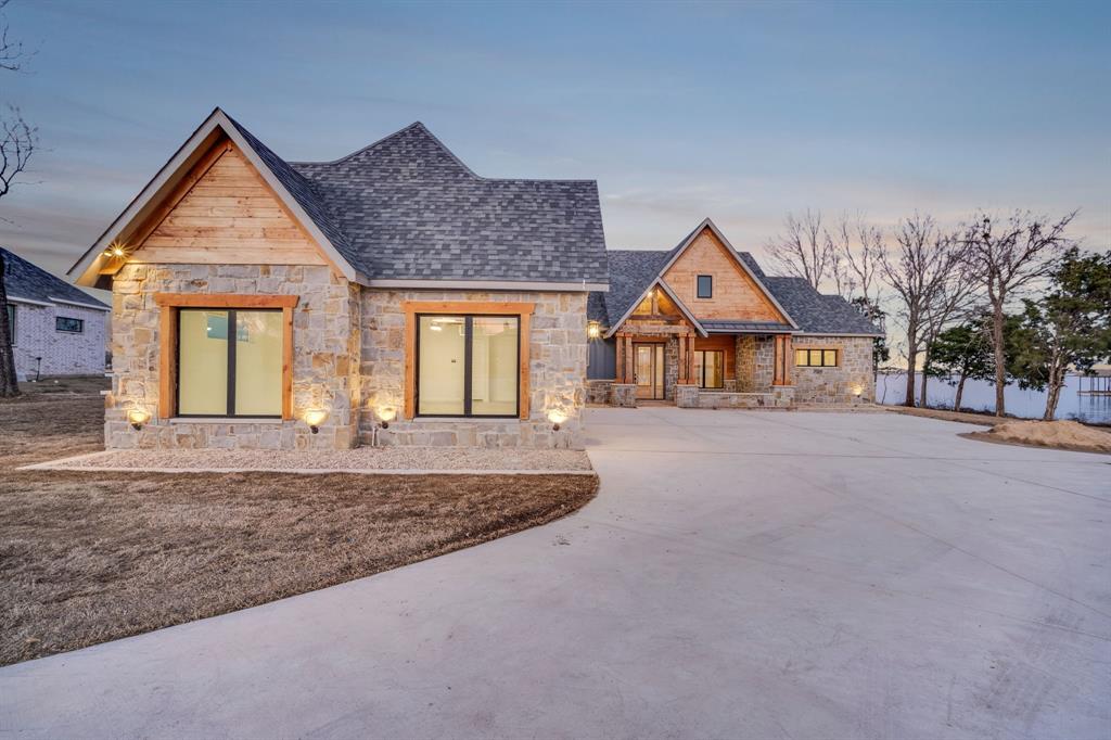 Lot 5 Slate Rock Road Ennis, TX 75119 - Photo 3 of 22 a front view of a house with a yard