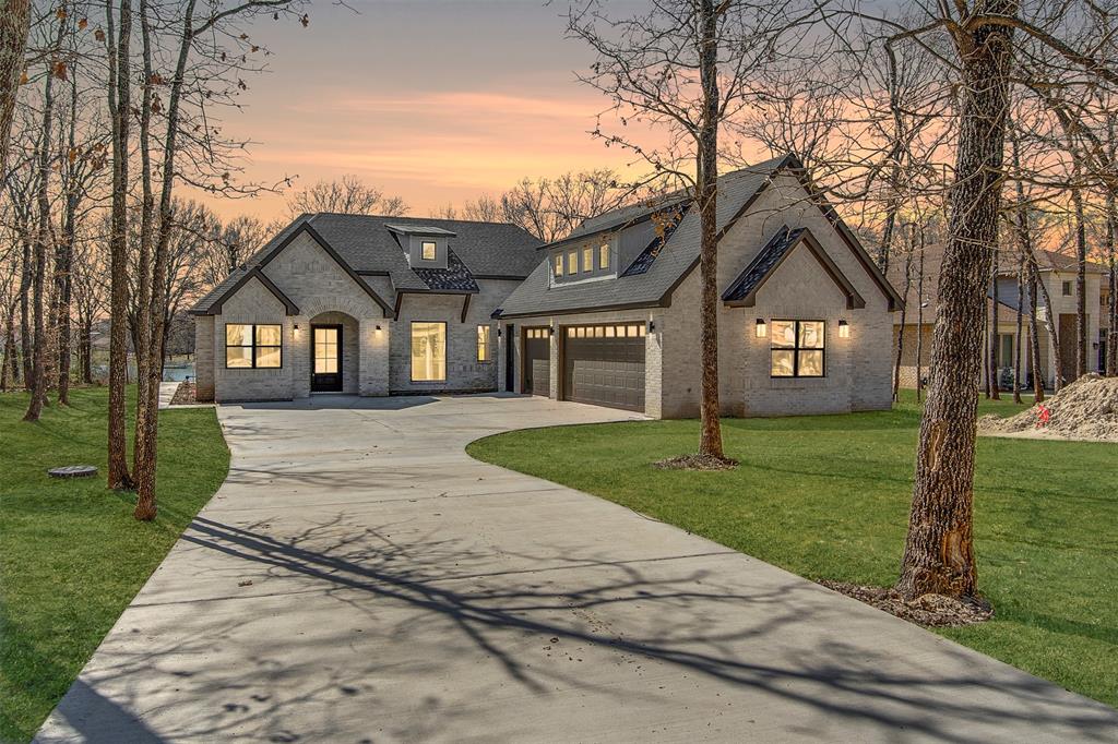 Lot 5 Slate Rock Road Ennis, TX 75119 - Photo 4 of 22 a front view of a house with a garden and trees