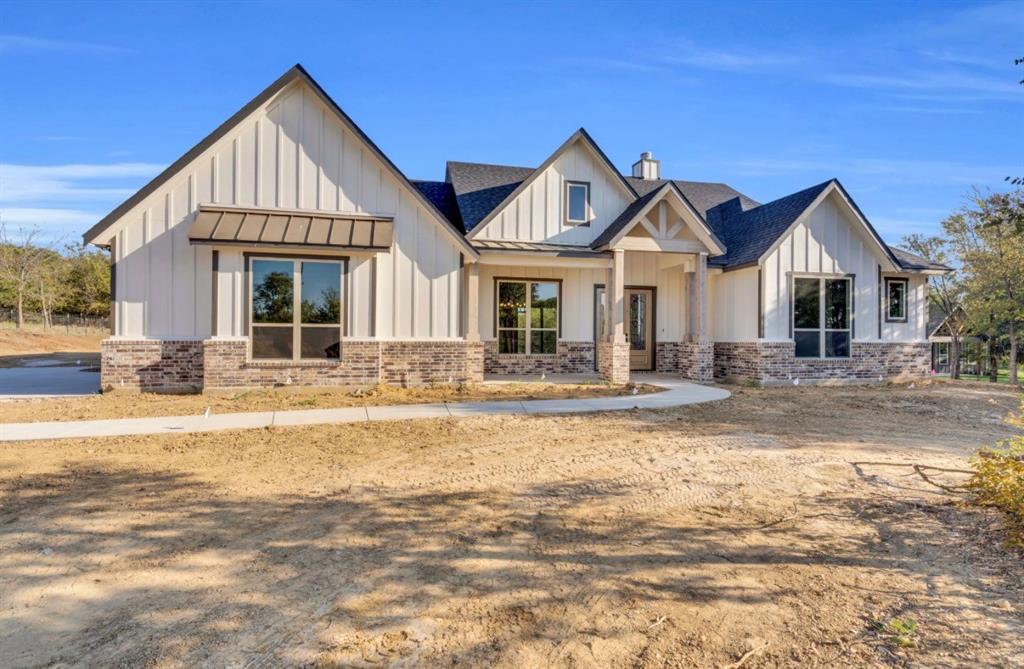 Lot 5 Slate Rock Road Ennis, TX 75119 - Photo 8 of 22 a front view of a house with a yard