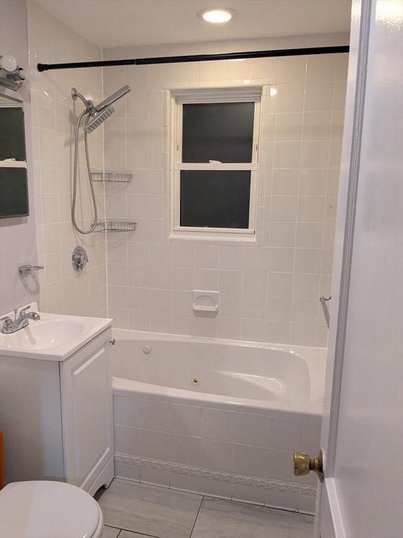 33 Paragon Road, Unit 1 Boston, MA 02132 - Photo 12 of 18 a bathroom with a sink a toilet and shower