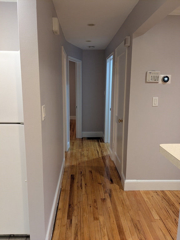 33 Paragon Road, Unit 1 Boston, MA 02132 - Photo 13 of 18 a view of a room with wooden floor and staircase