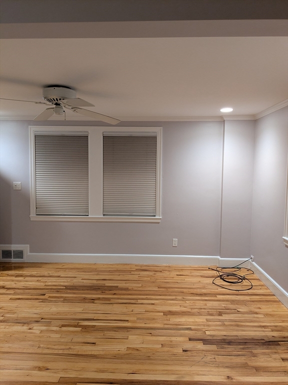 33 Paragon Road, Unit 1 Boston, MA 02132 - Photo 2 of 18 a view of a livingroom with an empty space
