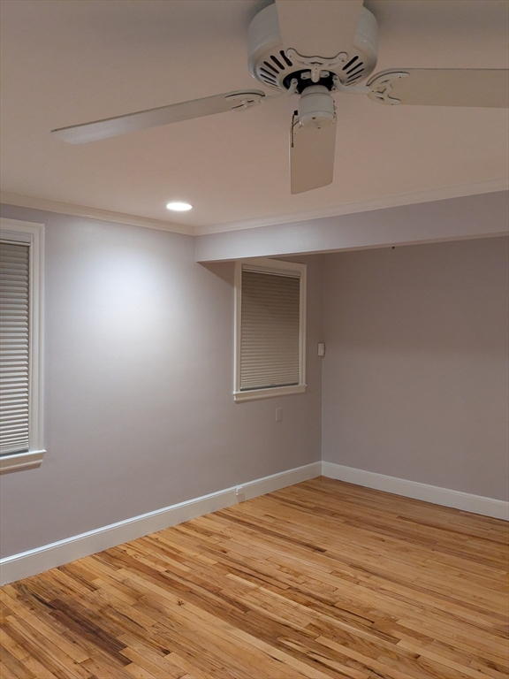 33 Paragon Road, Unit 1 Boston, MA 02132 - Photo 4 of 18 a view of a room with wooden floor and cabinets