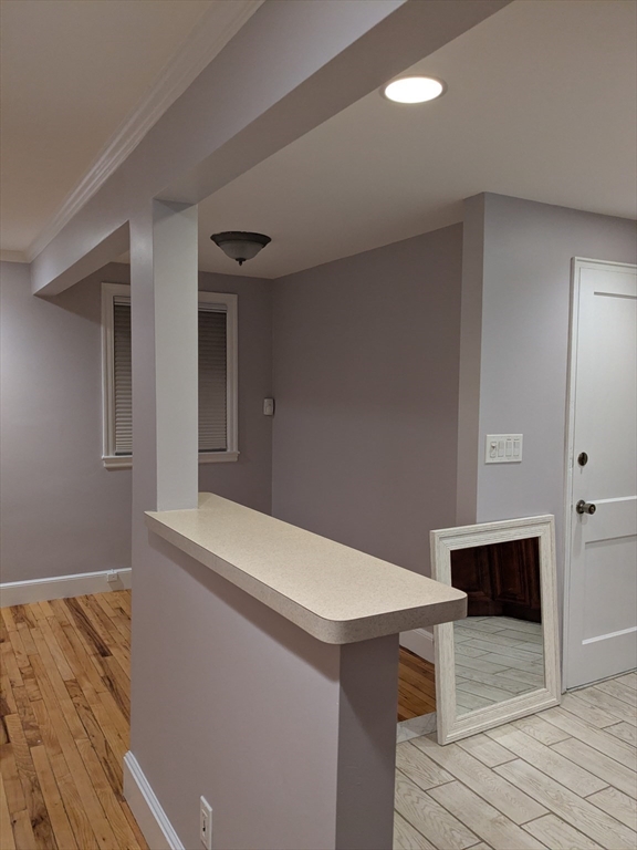 33 Paragon Road, Unit 1 Boston, MA 02132 - Photo 5 of 18 a view of kitchen with furniture and wooden floor