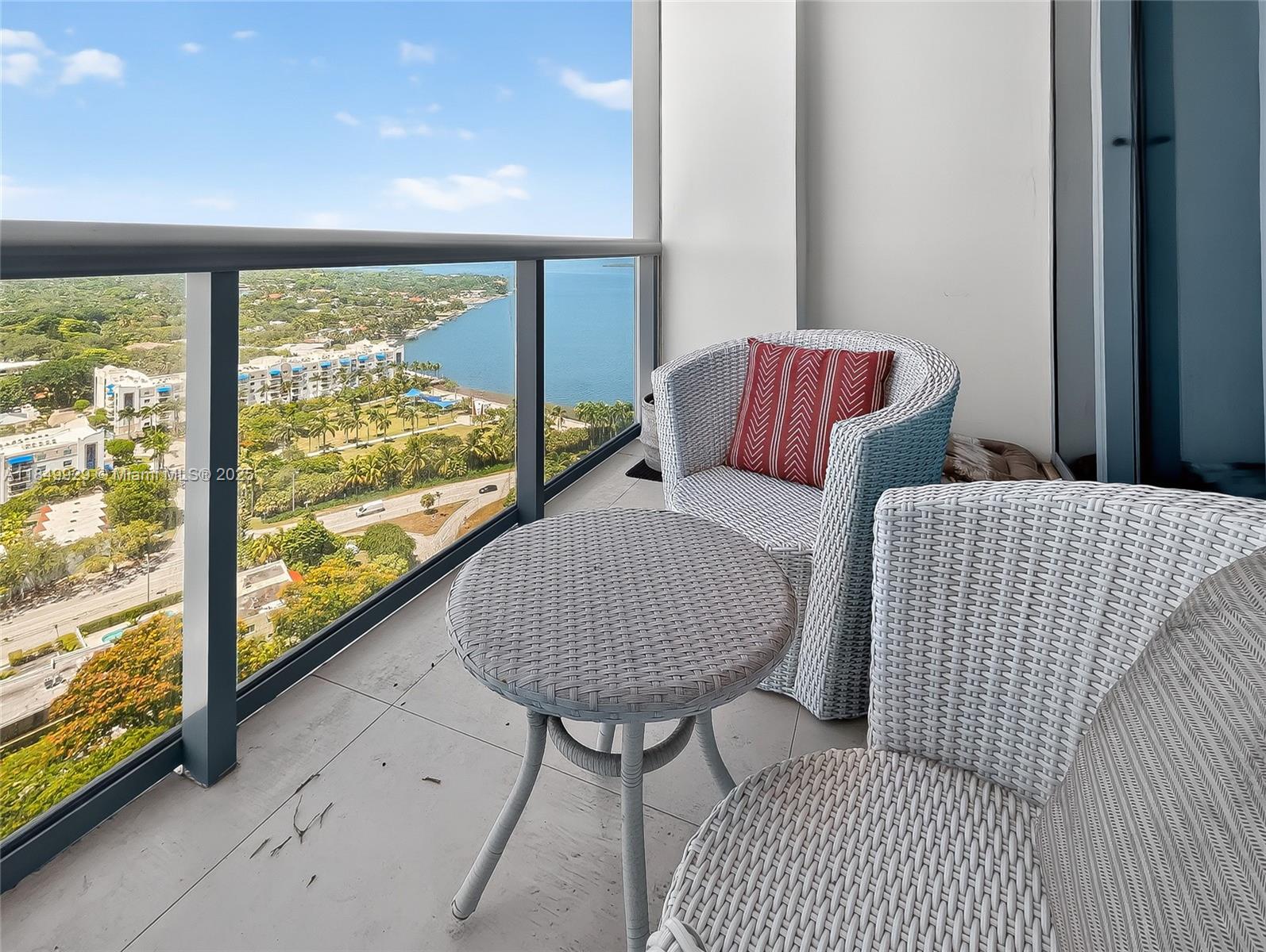 601 Northeast 36th Street, Unit 2201 Miami, FL 33137 - Photo 11 of 42 a living room with furniture and a floor to ceiling window