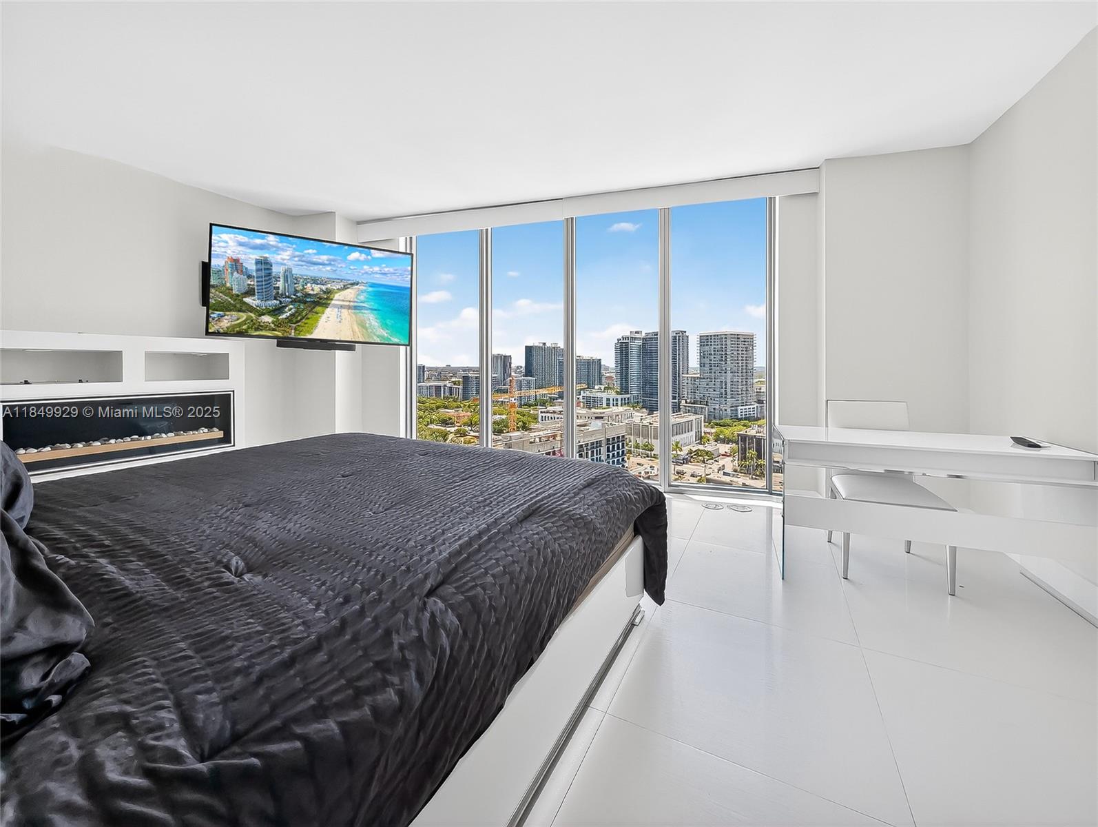 601 Northeast 36th Street, Unit 2201 Miami, FL 33137 - Photo 15 of 42 a bed sitting in a room next to a window