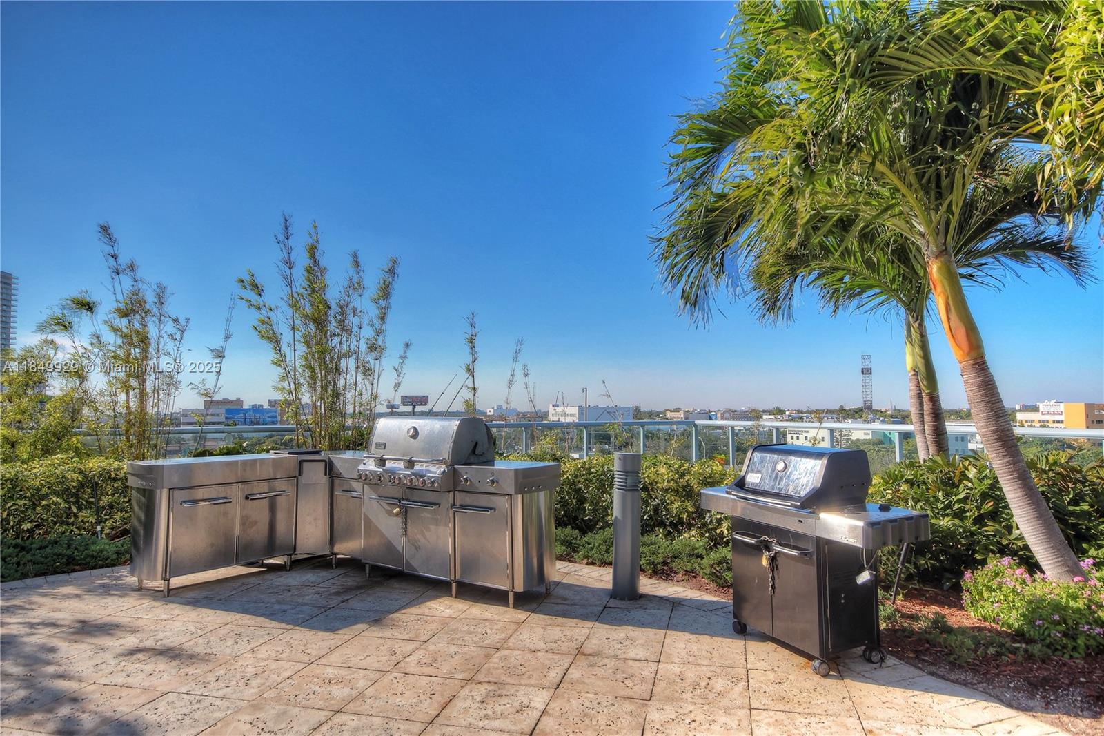 601 Northeast 36th Street, Unit 2201 Miami, FL 33137 - Photo 26 of 42 a view of a backyard with plants and outdoor seating