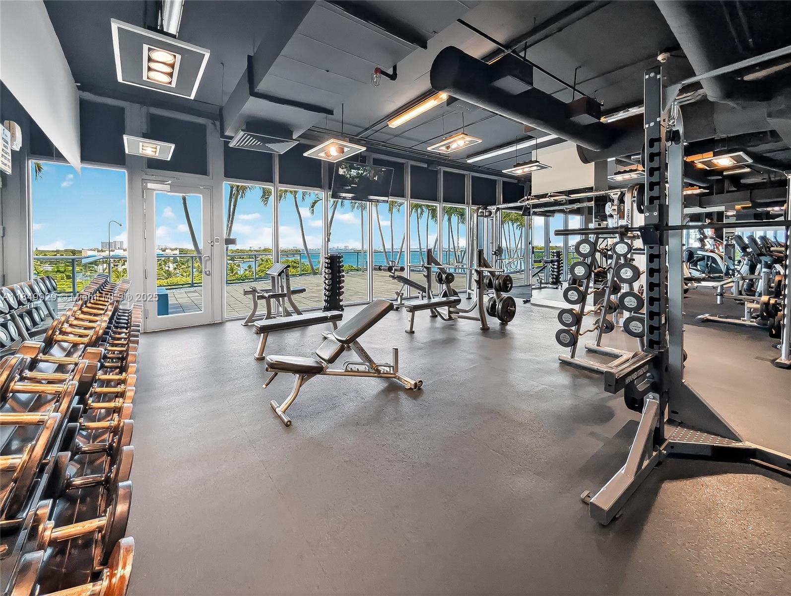 601 Northeast 36th Street, Unit 2201 Miami, FL 33137 - Photo 29 of 42 a view of a room with gym equipment