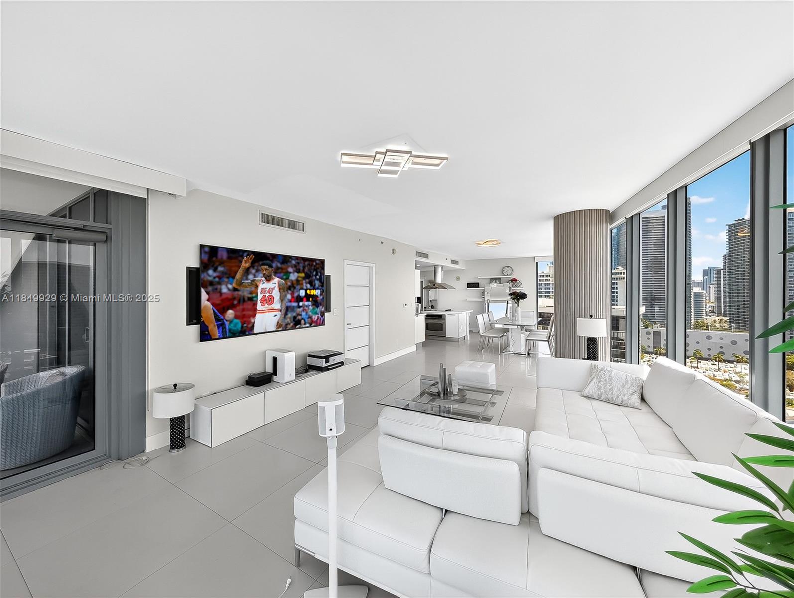 601 Northeast 36th Street, Unit 2201 Miami, FL 33137 - Photo 3 of 42 a living room with furniture and a flat screen tv