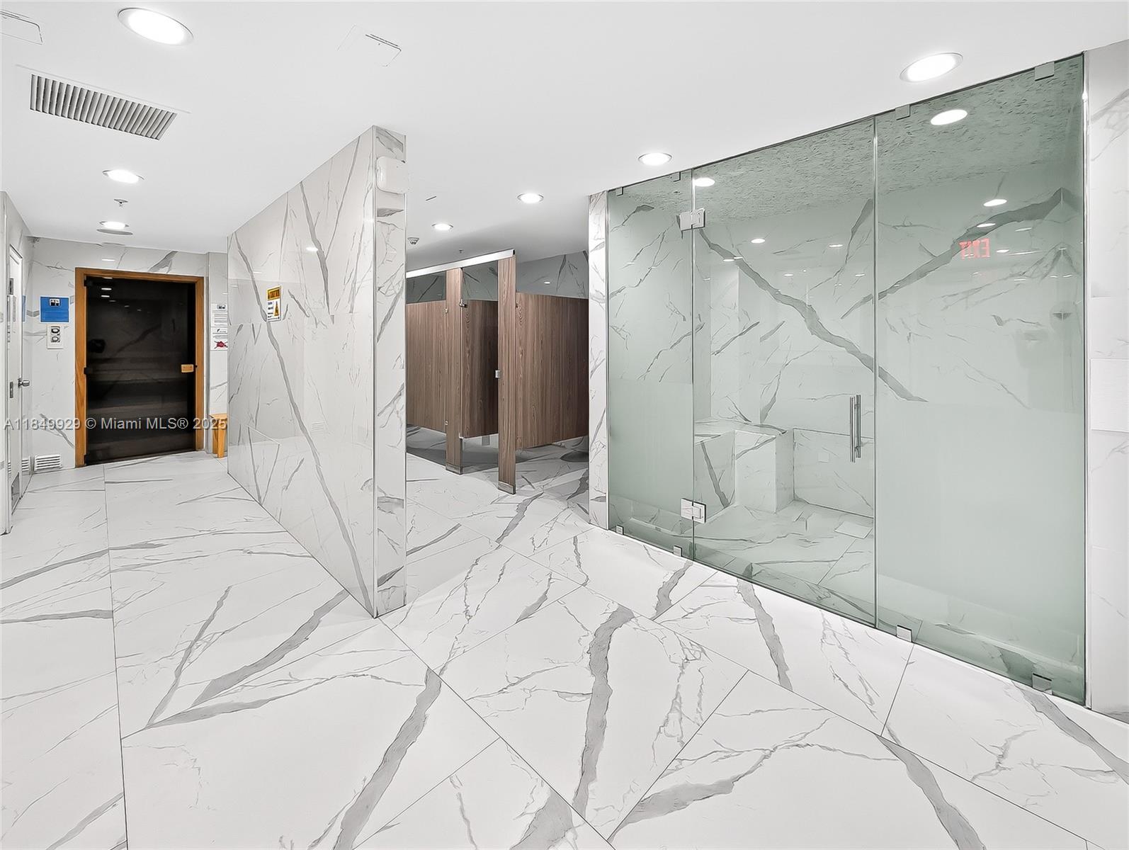 601 Northeast 36th Street, Unit 2201 Miami, FL 33137 - Photo 32 of 42 a bathroom with a sink and a mirror