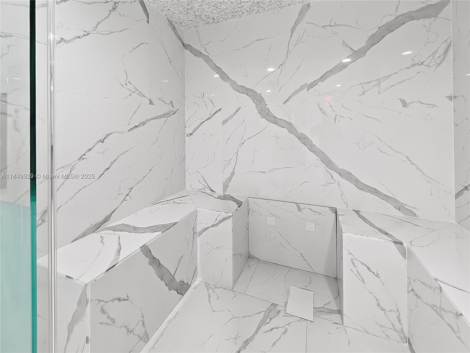 601 Northeast 36th Street, Unit 2201 Miami, FL 33137 - Photo 33 of 42 a bathroom with a bathtub and shower