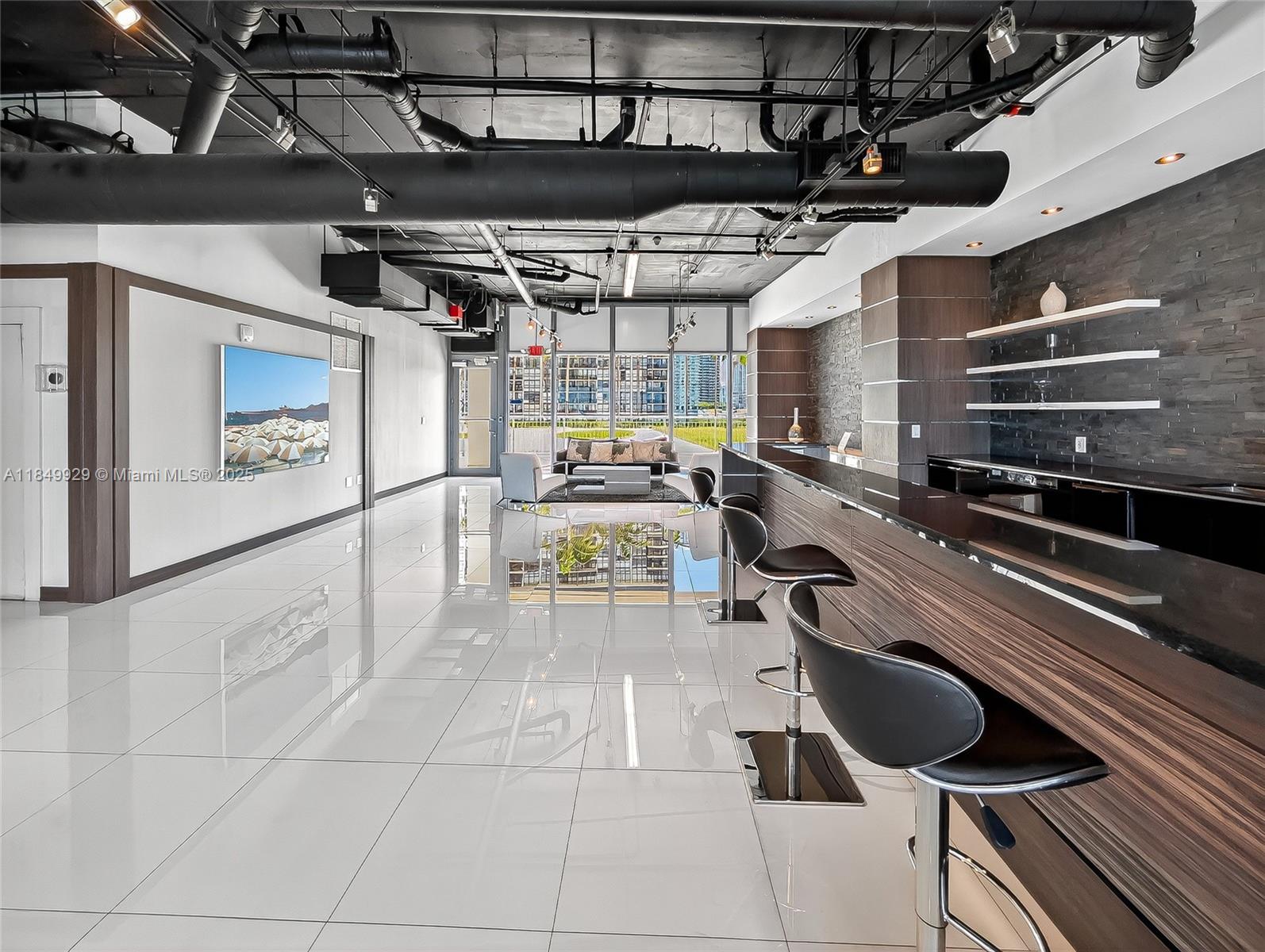 601 Northeast 36th Street, Unit 2201 Miami, FL 33137 - Photo 35 of 42 a kitchen with a sink a counter and appliances