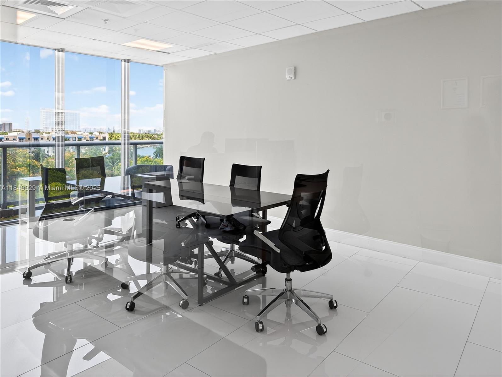601 Northeast 36th Street, Unit 2201 Miami, FL 33137 - Photo 40 of 42 a view of a livingroom with furniture and a floor to ceiling window