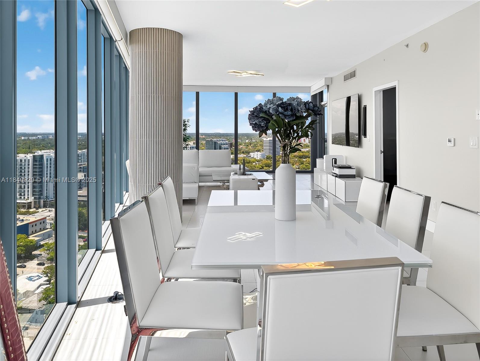 601 Northeast 36th Street, Unit 2201 Miami, FL 33137 - Photo 6 of 42 a view of kitchen with furniture and wooden floor