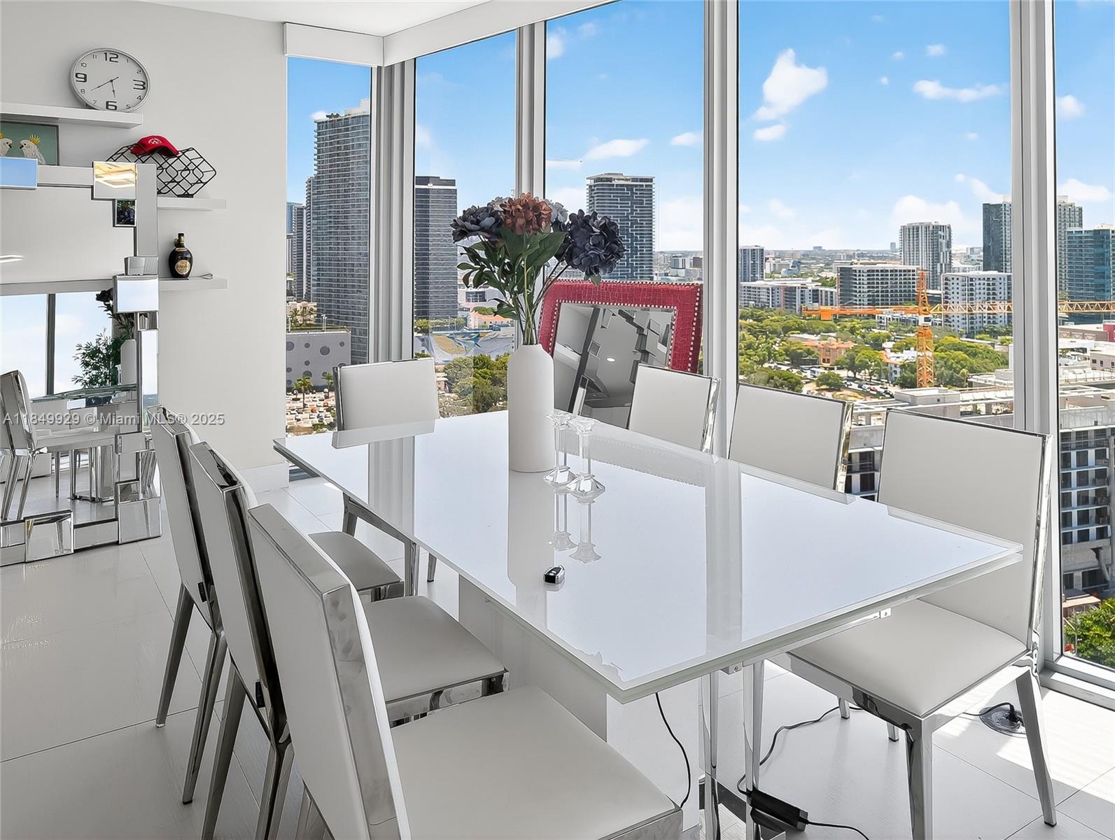 601 Northeast 36th Street, Unit 2201 Miami, FL 33137 - Photo 8 of 42 a view of table and chairs