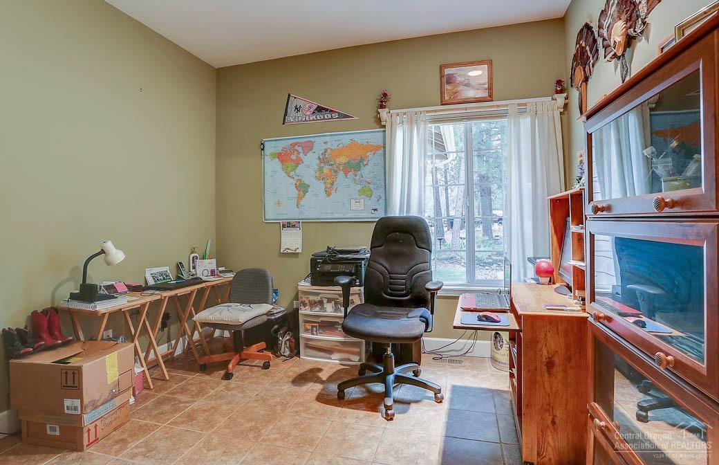 60031 Hopi Road Bend, OR 97702 - Photo 12 of 20 a view of a workspace with furniture and a window