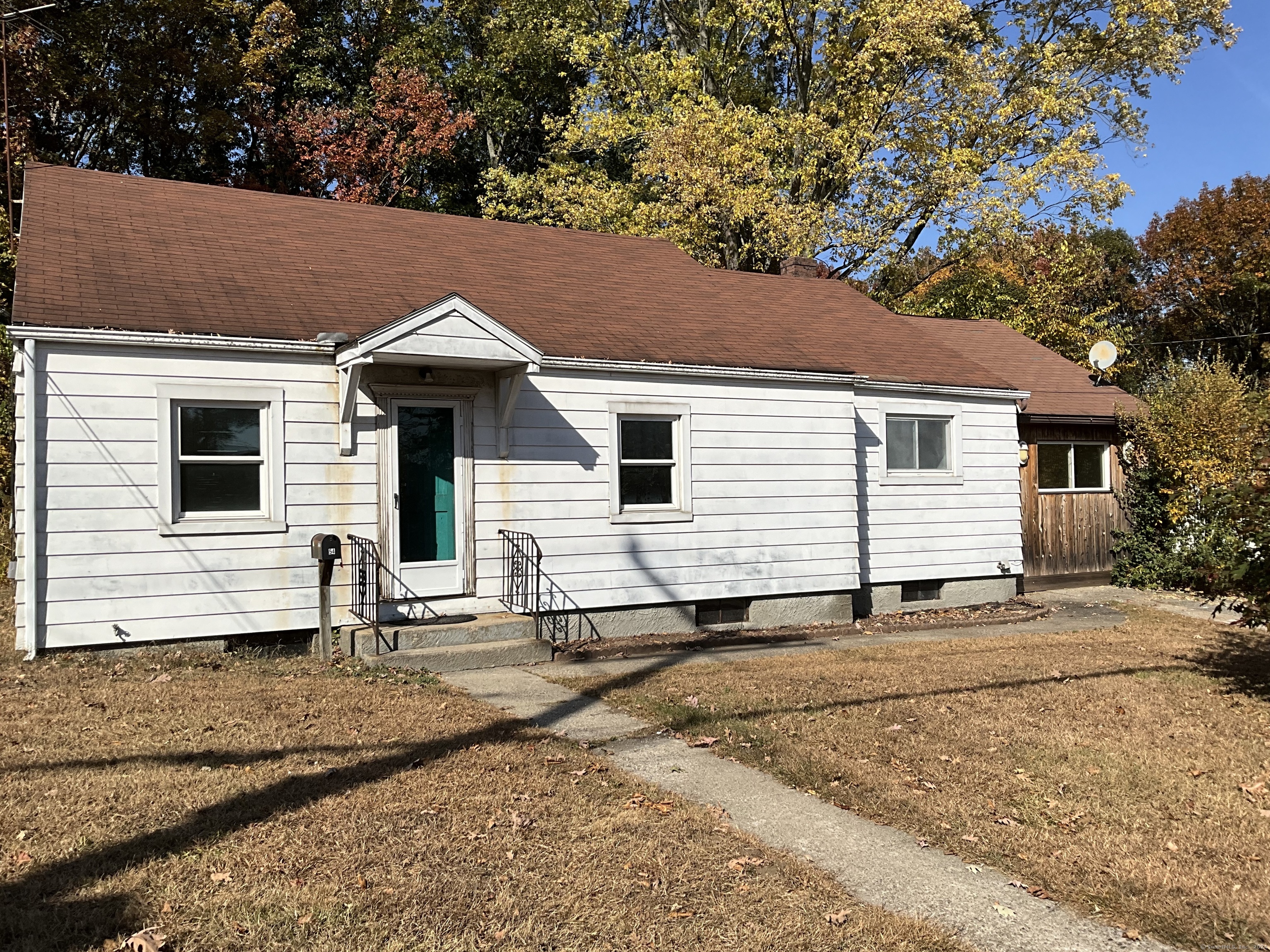 a front view of a house with yard