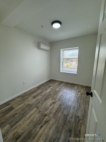 61 Colony Street, Unit 3C Meriden, CT 06451 - Photo 5 of 8 an empty room with windows