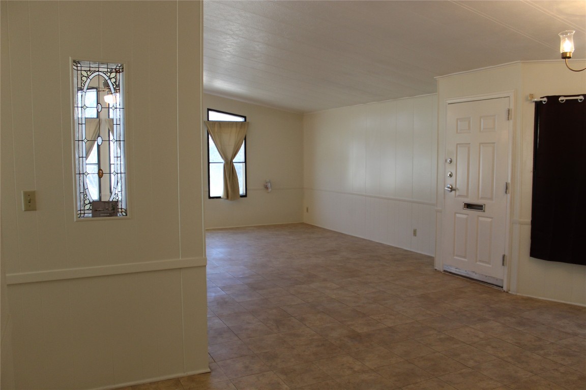 14111 South Green Hills Loop, Unit B Austin, TX 78737 - Photo 11 of 13 an empty room with windows and closet