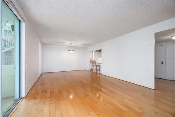 a view of kitchen with furniture and wooden floor