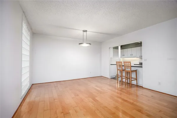 a bedroom with a bed a couch and dresser