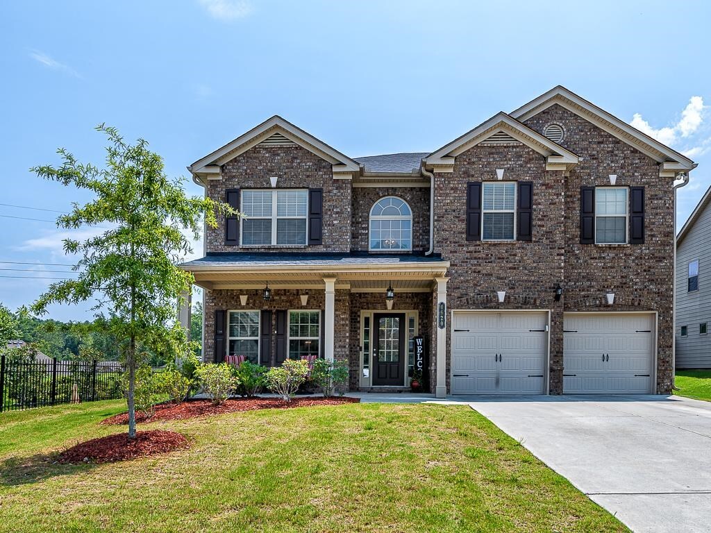 4620 Mossbrook Circle, Unit 25 Alpharetta, GA 30004 - Photo 1 of 1 a front view of a house with a yard