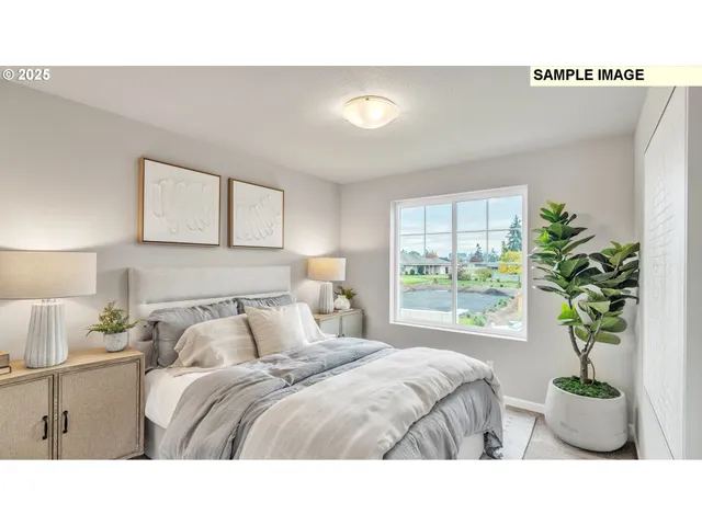 a bedroom with a bed and window