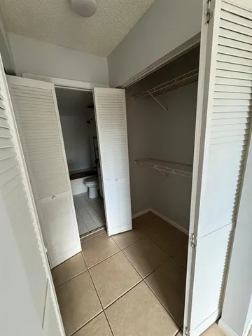 a kitchen with a stove a sink and a refrigerator